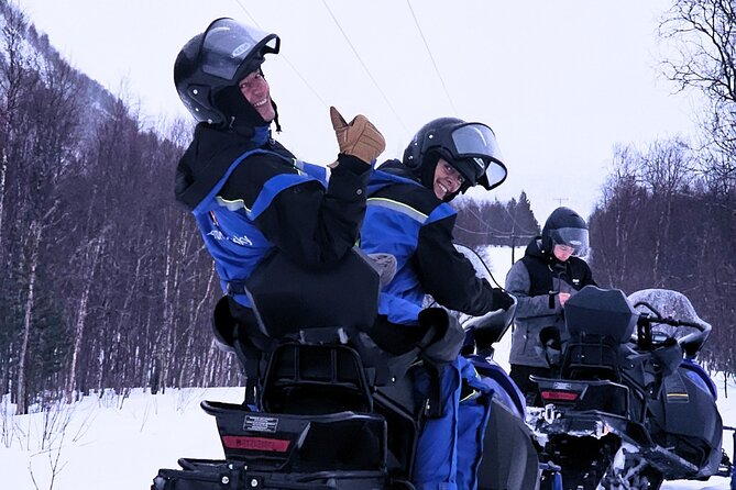Driving Ski-Doo Snowmobile Adventure 5 Hours Photos included - Warming up with food and hot drinks