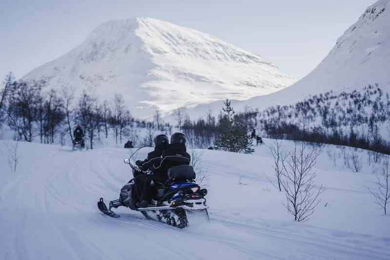 From Tromsø: Snowmobiling at Camp Tamok & Snow Park Visit - From Tromsø to Camp Tamok by bus