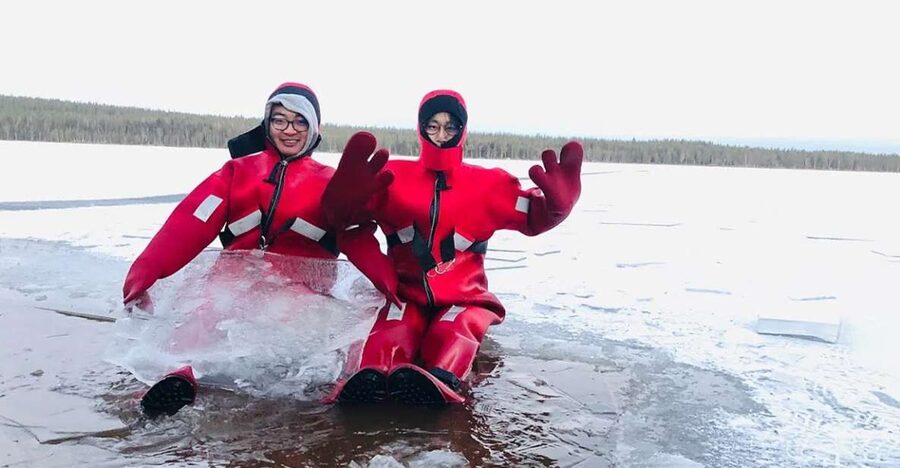 Lapland: Ice Fishing, Floating & BBQ Snow Adventure - Reaching the frozen lake in proper winter clothing