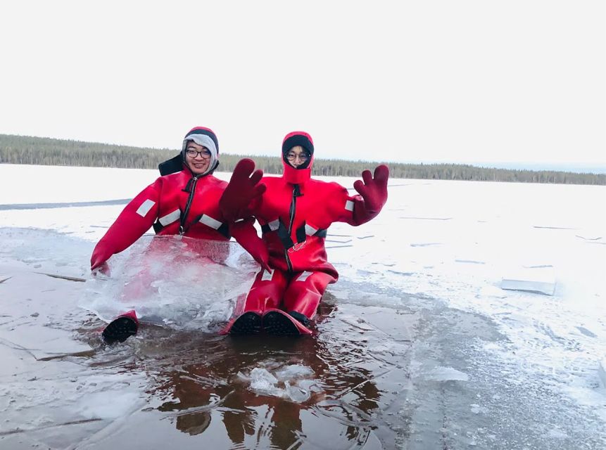 Lapland: Ice Fishing, Floating & BBQ Snow Adventure - Learning how to make an ice-fishing hole