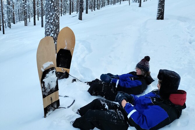 Private 2-Hour Snowboarding in Levi - Reaching the hill with poles and snowshoes