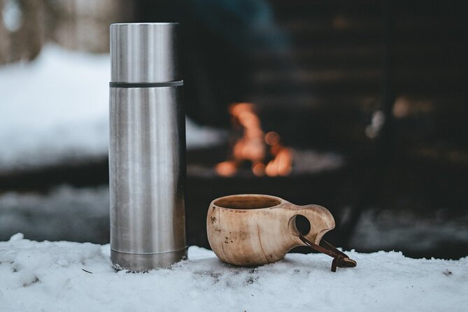 Rovaniemi: Snowshoeing in a magical snowy forest - Sausages, hot juice, and a fire in the forest
