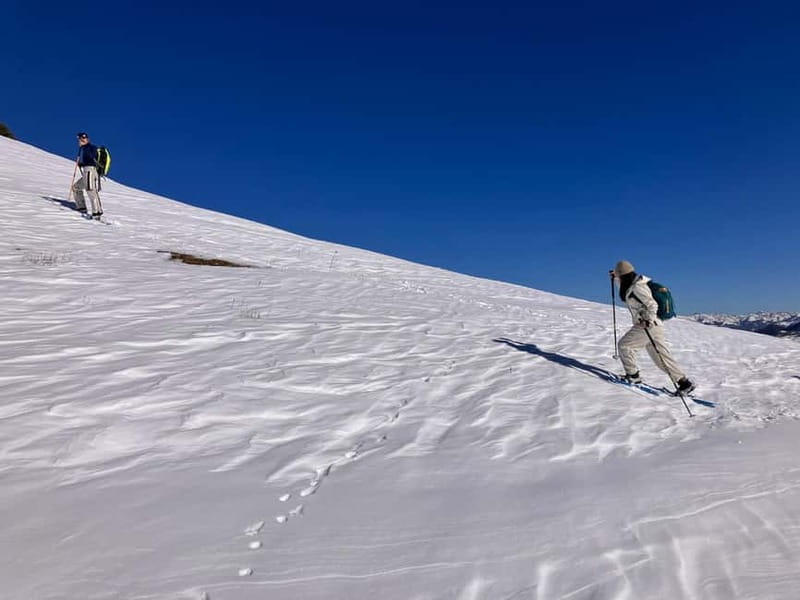 Snowshoeing in Bakuriani, Caucasus Mountains - A traditional village adds local context